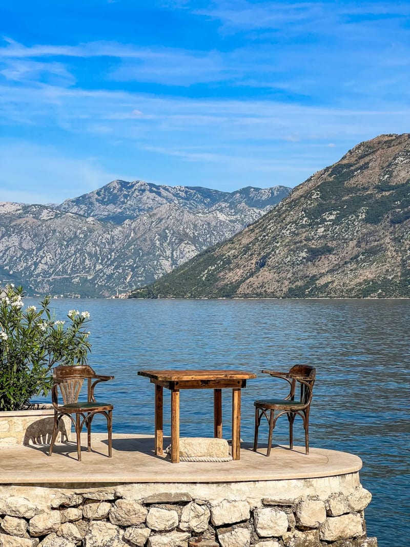 Table and chairs on the bay of Kotor in Montenegro