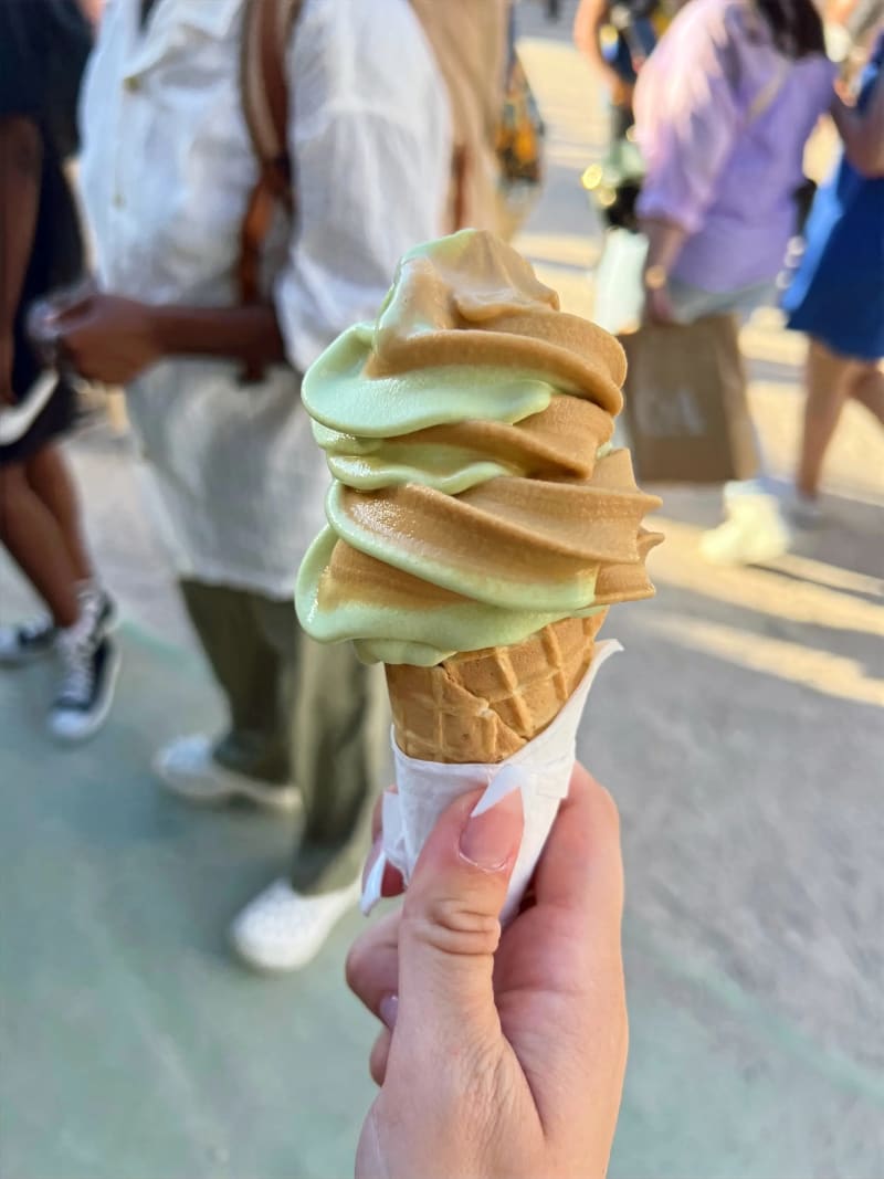 A pistachio and caramel ice cream cone