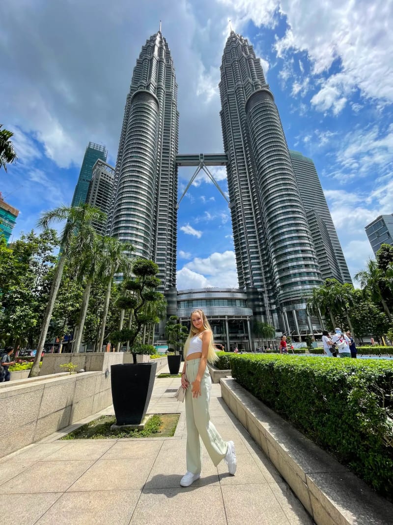 Girl in front of the Petronas Twin Towers in Kuala Lumpur, Malaysia
