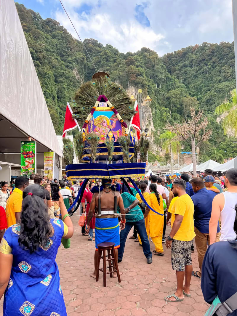 A man carrying a Kavadi during a Hindu ritual at the Batu Caves in Kuala Lumpur, Malaysia