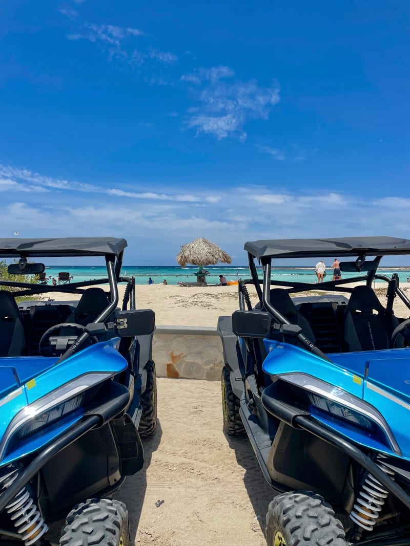 4-wheelers parked in front of a Baby Beach in the Caribbean