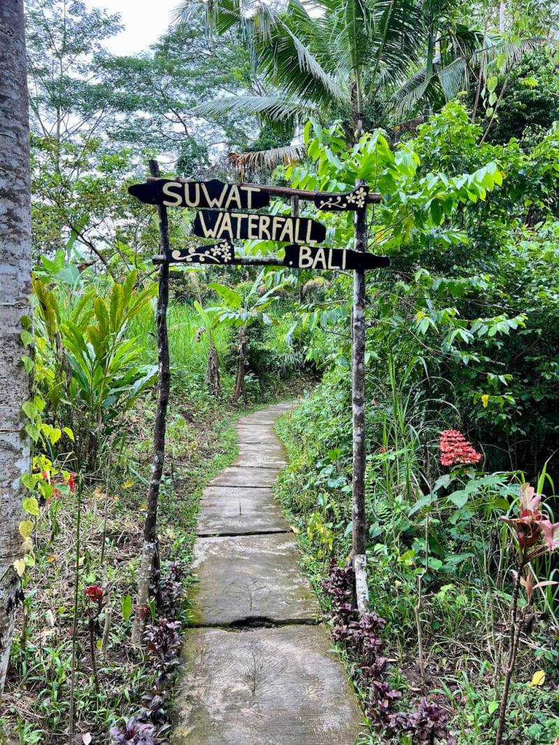 Entrance and signage for Suwat waterfall in Ubud