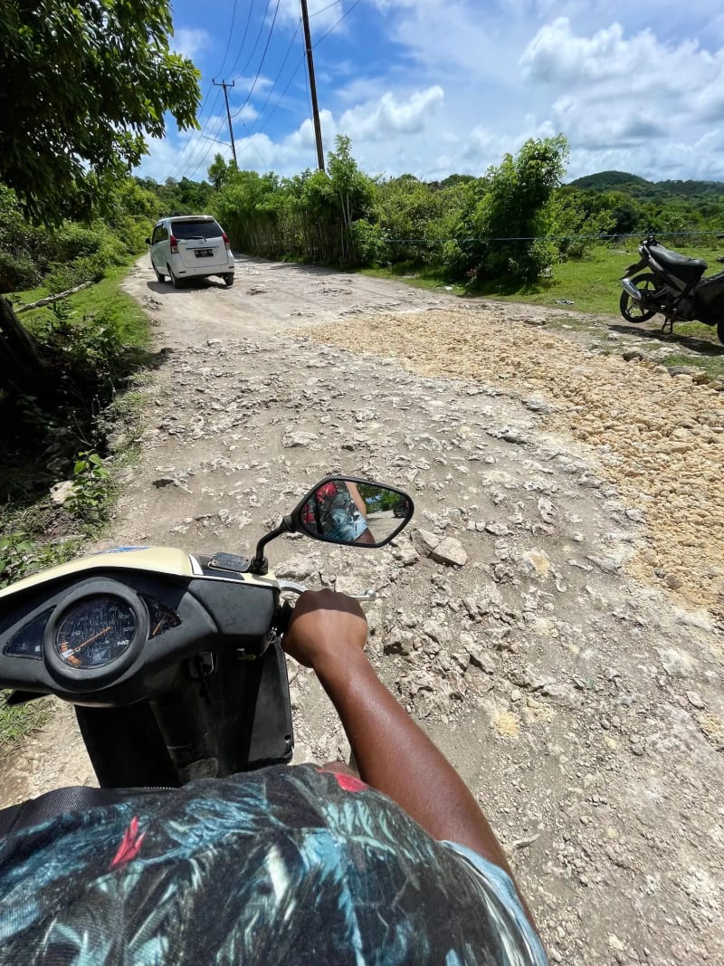 Riding on a scooter on Nusa Penida in Indonesia