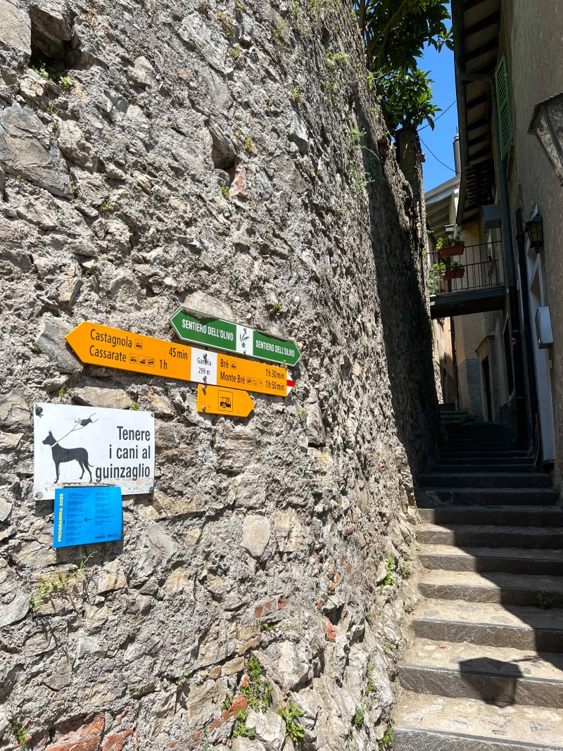 Trail signs in Gandria old town for the Olive Grove Trail
