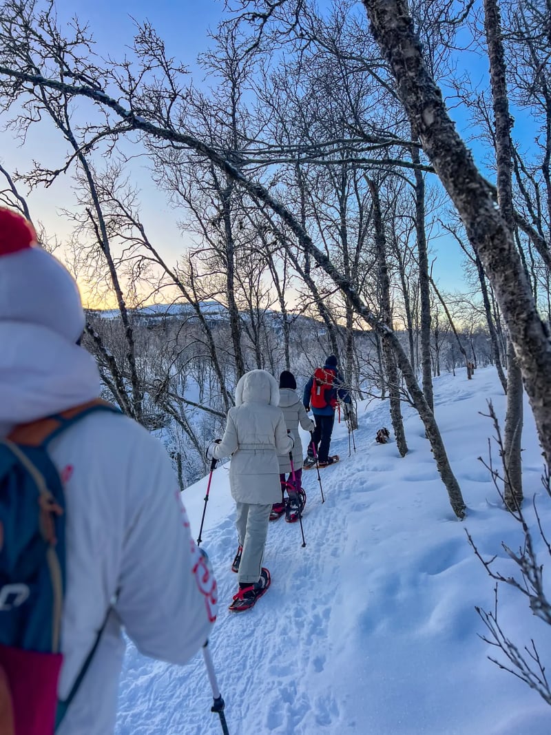 Snowshoeing in the snowy mountains of Tromsø Norway in the winter