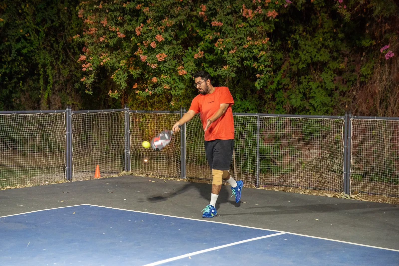 A player returns a shot during a FindYourFit tournament match