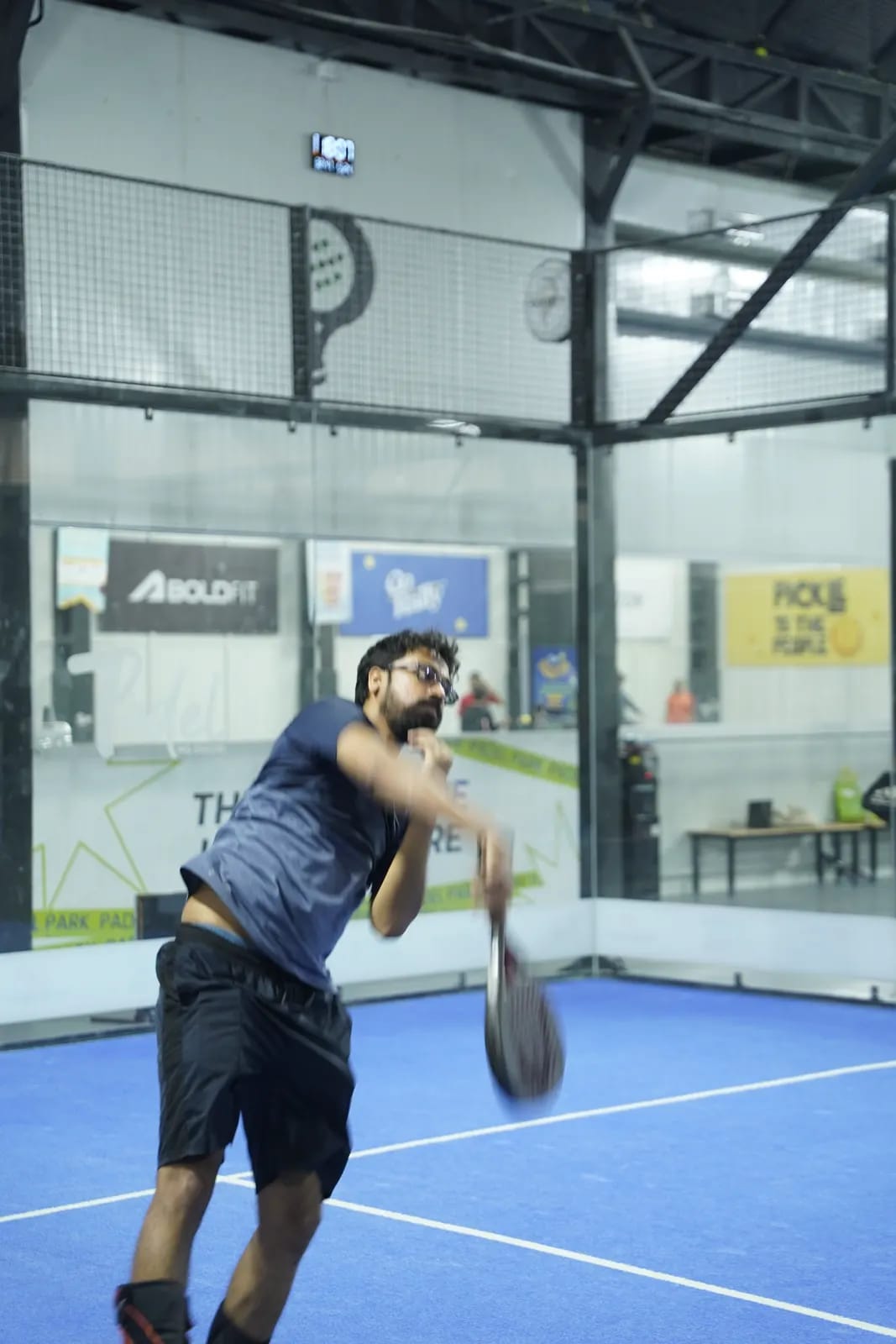 Indoor padel action at a FindYourFit tournament