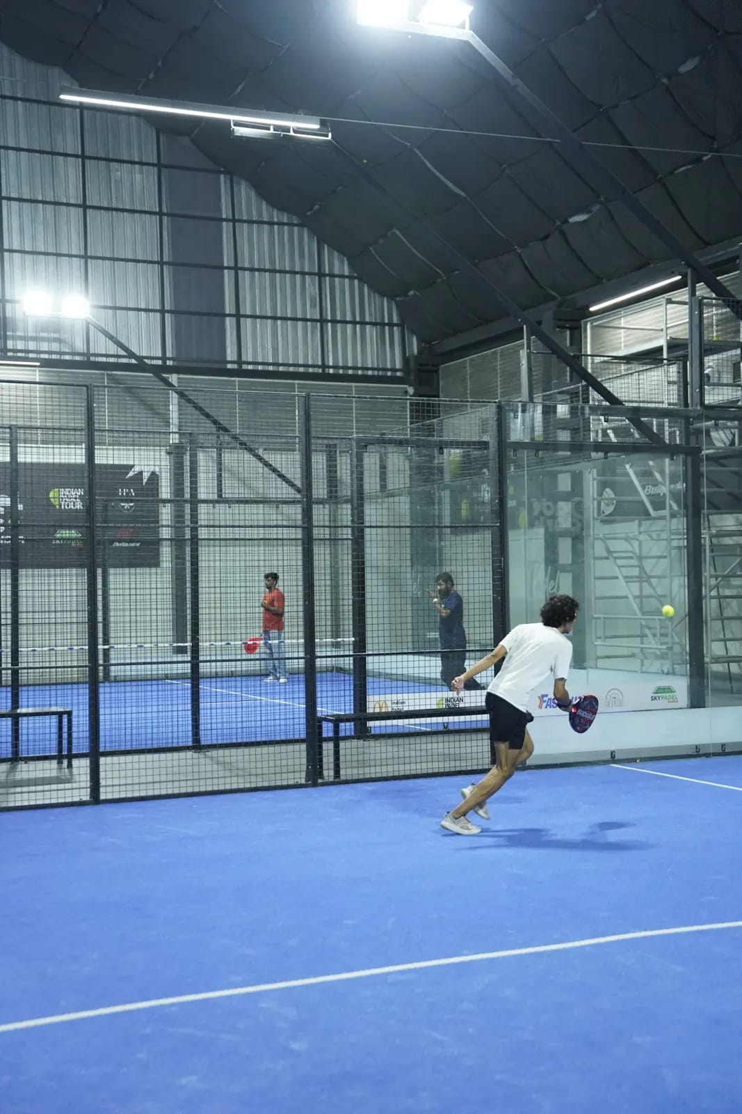 Indoor padel action at a FindYourFit tournament