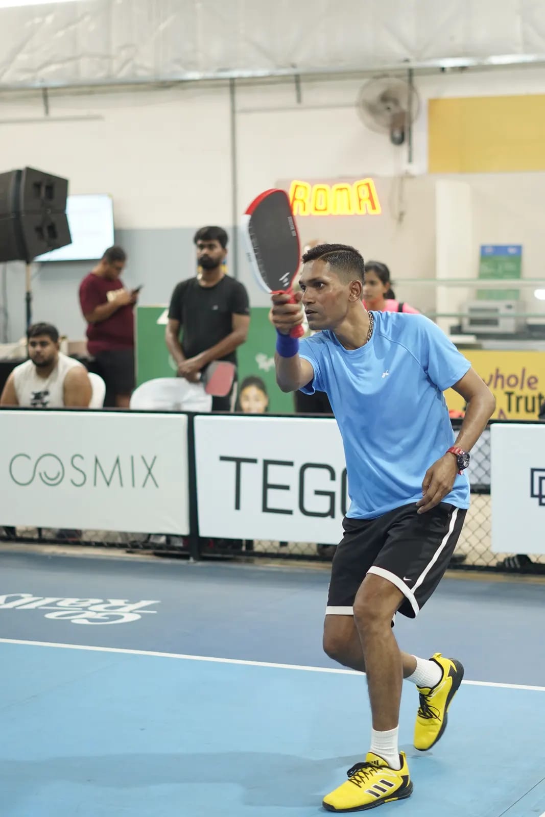 Indoor pickleball action at a FindYourFit tournament