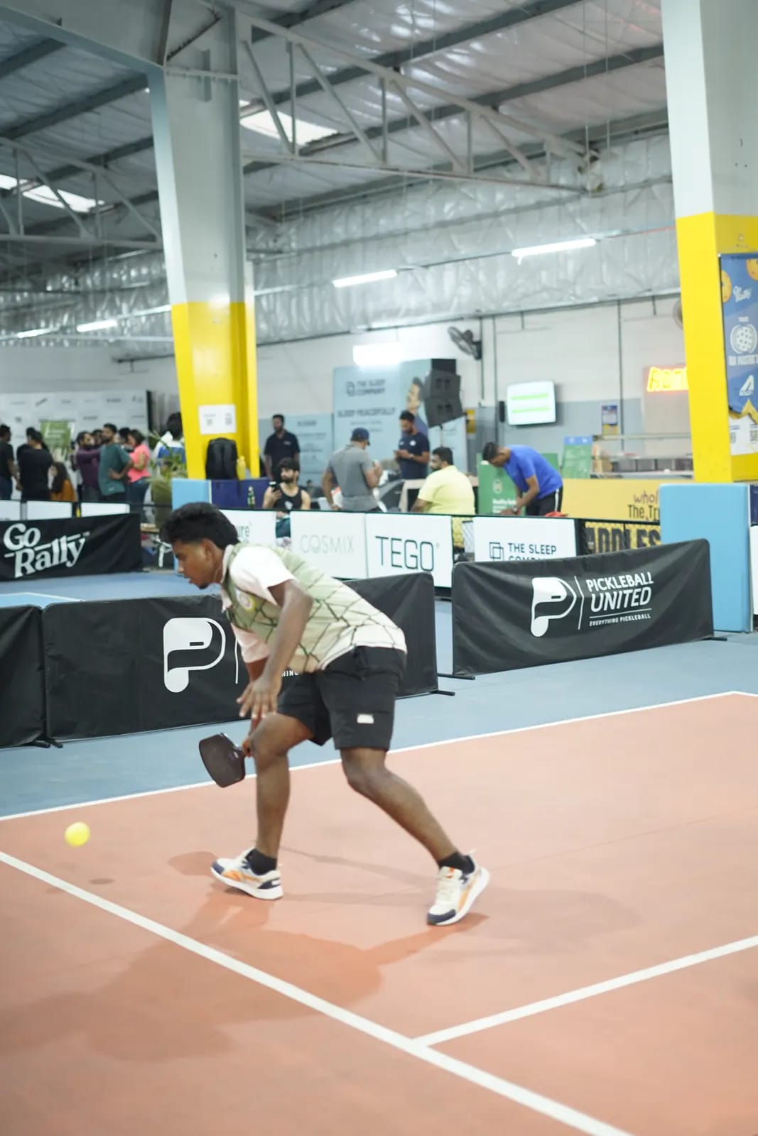 A player moves for a low shot at an indoor FindYourFit arena