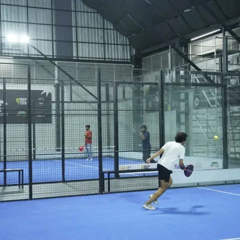 Indoor padel action at a FindYourFit tournament
