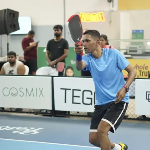 Indoor pickleball action at a FindYourFit tournament