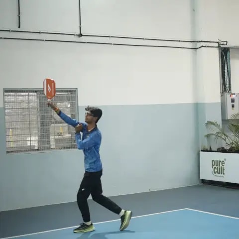 Indoor pickleball action at a FindYourFit tournament