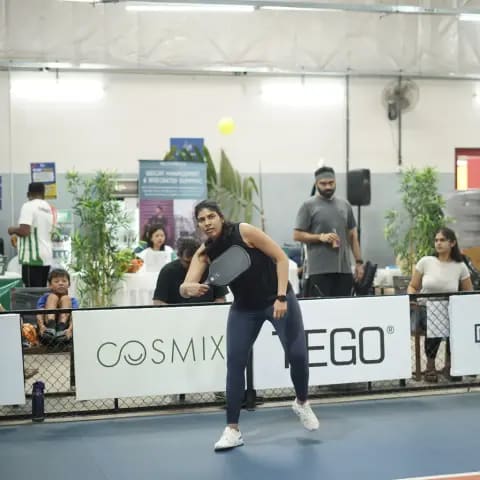 Indoor pickleball action at a FindYourFit tournament