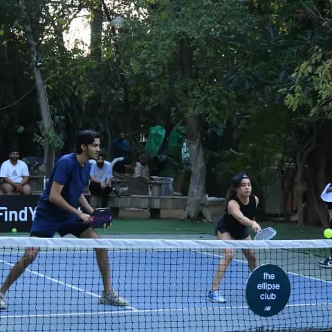Players rallying at a FindYourFit pickleball & padel night