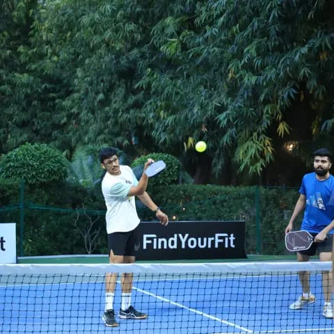 Players rallying at a FindYourFit pickleball & padel night