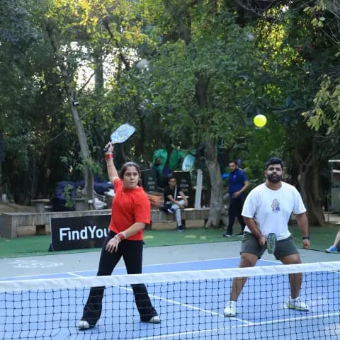 Players rallying at a FindYourFit pickleball & padel night