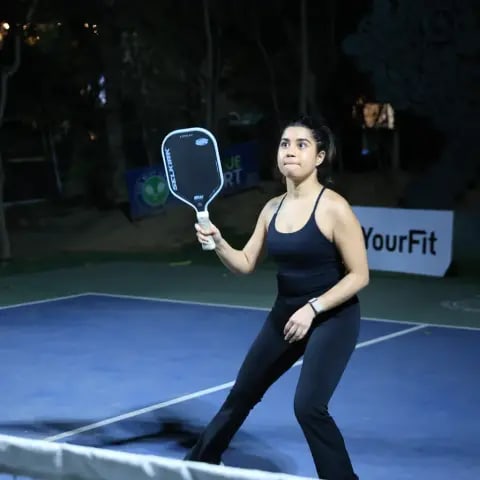 Players rallying at a FindYourFit pickleball & padel night