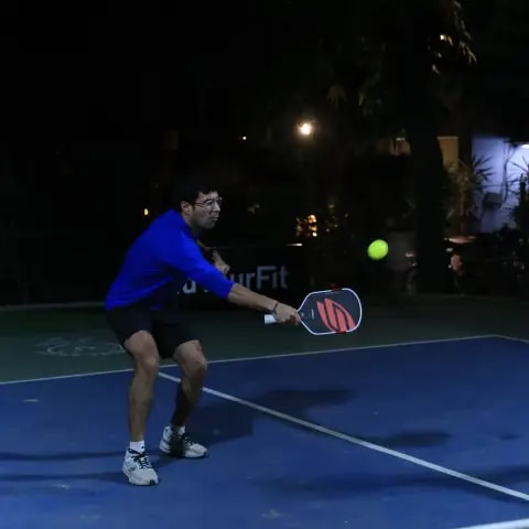 Players rallying at a FindYourFit pickleball & padel night