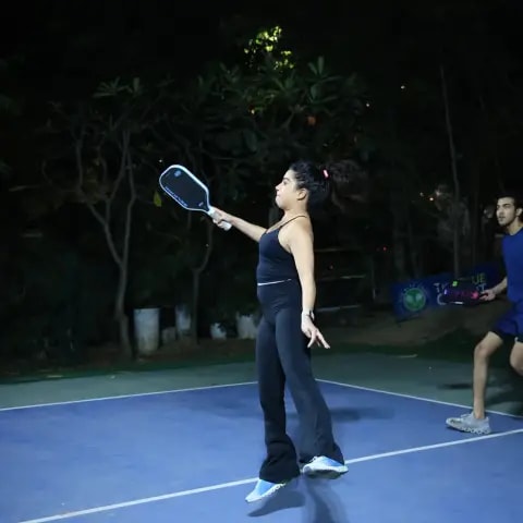 Players rallying at a FindYourFit pickleball & padel night