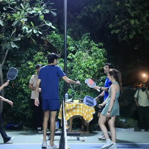 Players rallying at a FindYourFit pickleball & padel night