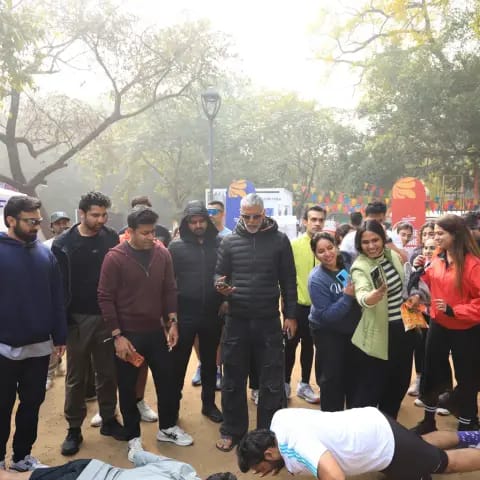 Participants warming up together at The Wellness Carnival