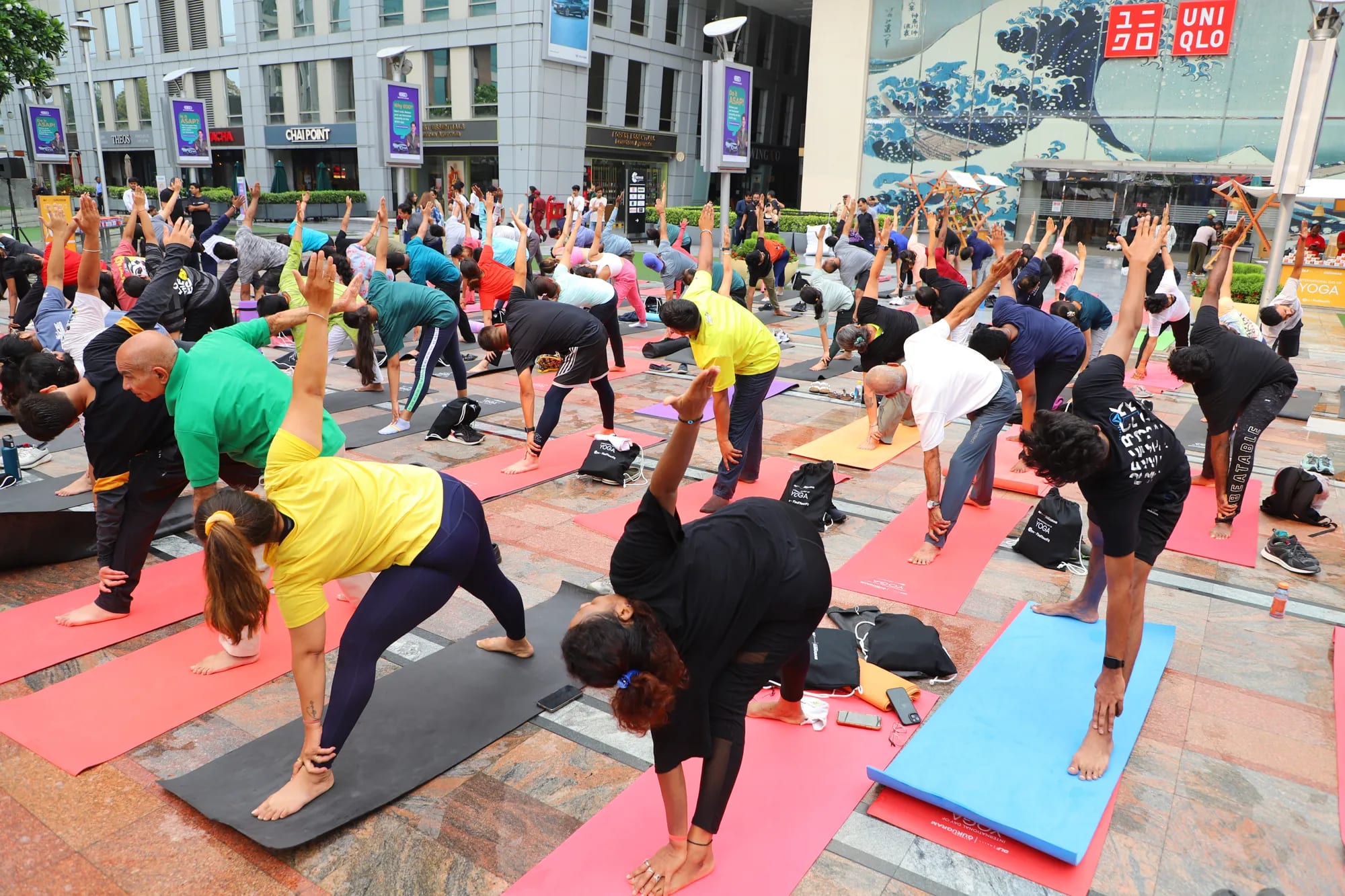 A mass yoga and stretching session on the street at a FindYourFit event