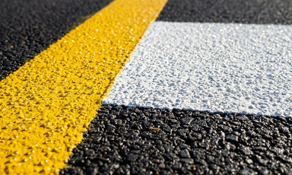 Thermoplastic road marking and industrial safety floor line demarcation in parking bays and warehouse traffic aisles