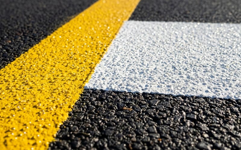 Commercial aviation aircraft hangar floor with high-gloss chemical-resistant coating and precision taxiway line markings in Kenya