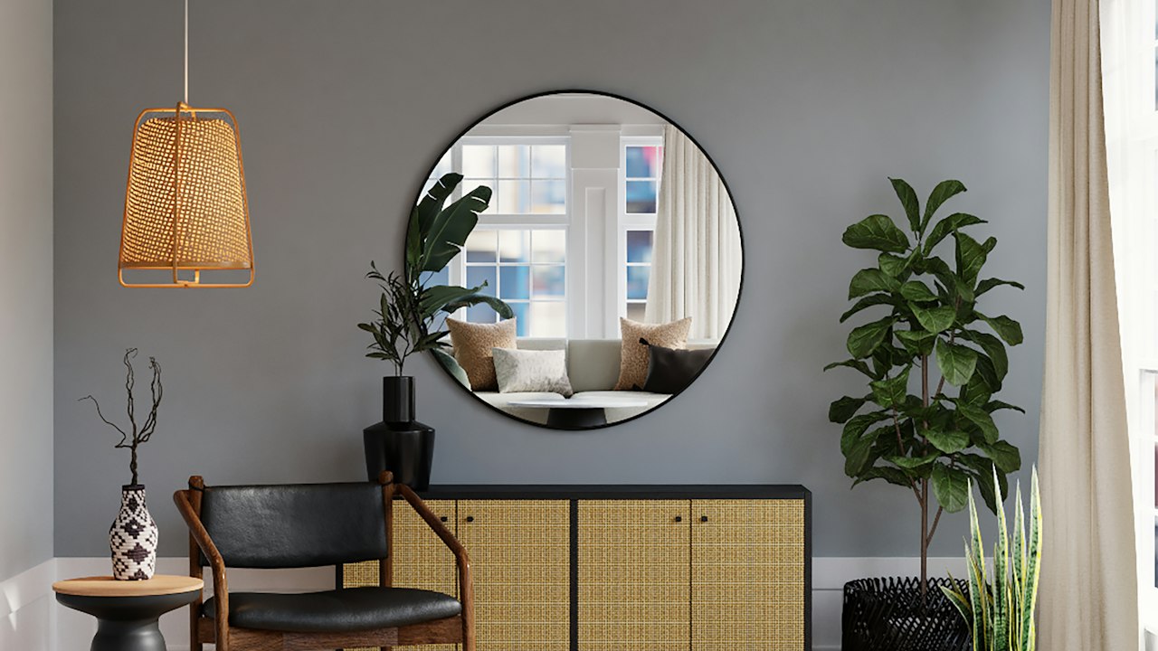 Charcoal Grey painted feature wall in a formal dining room with modern brass chandelier