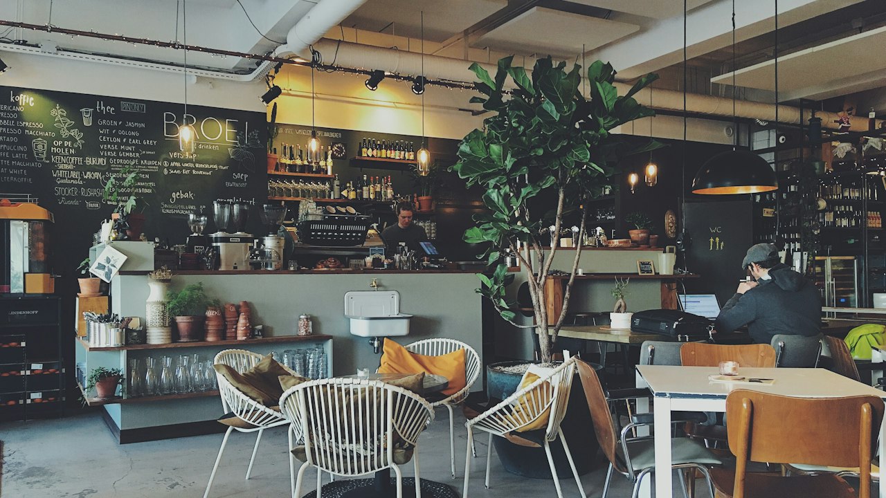 Coffee Cream paint on cafe walls with timber banquette seating in Nairobi CBD