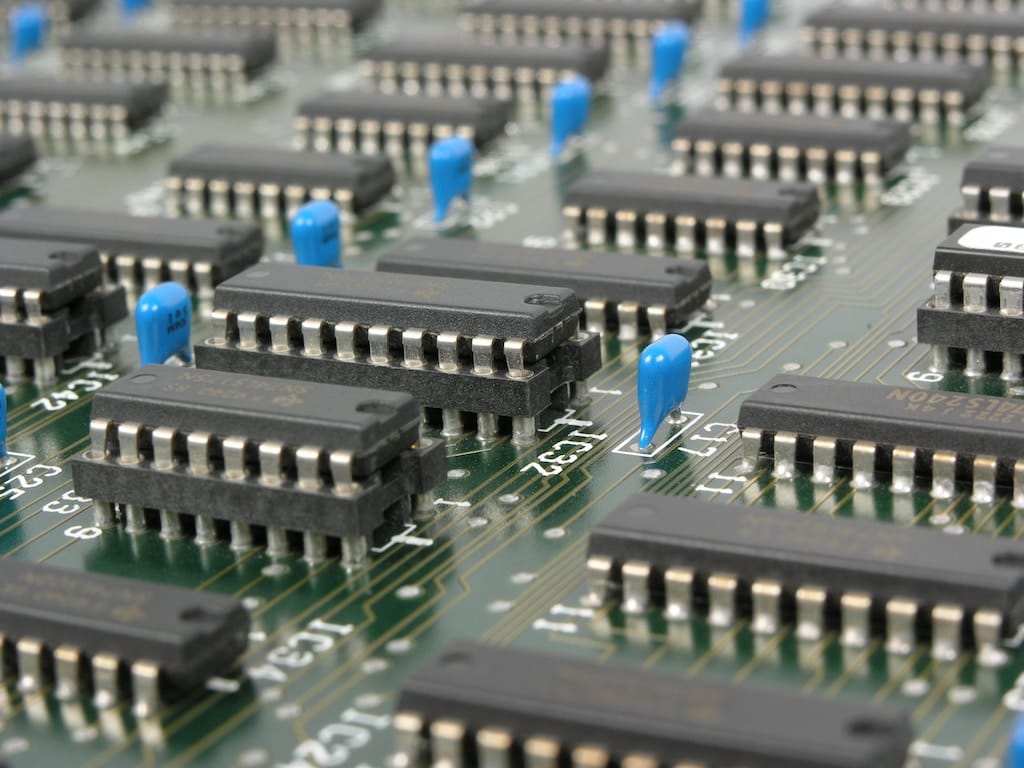 close up photo of a computer chip motherboard