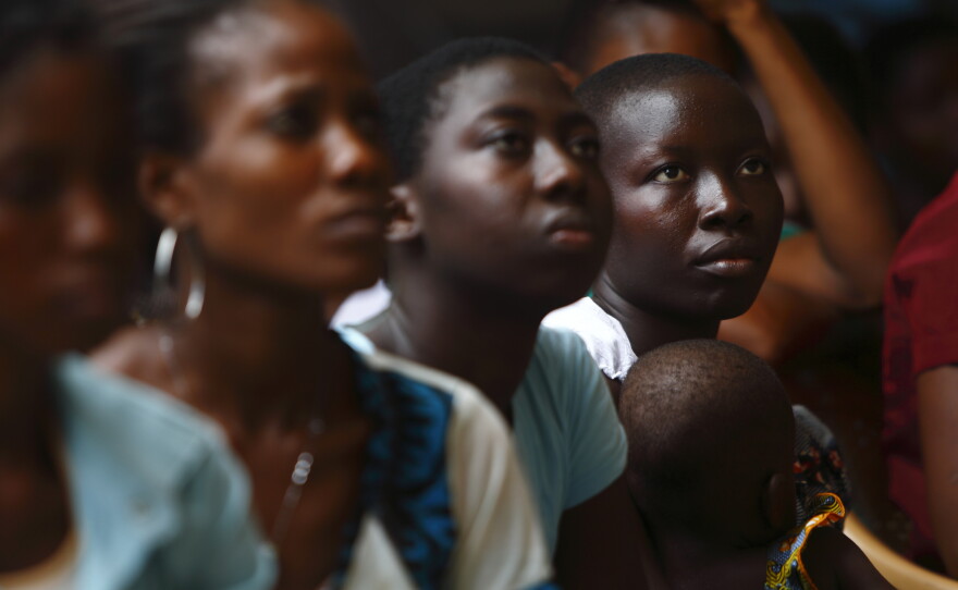 A community volunteer connecting with a child