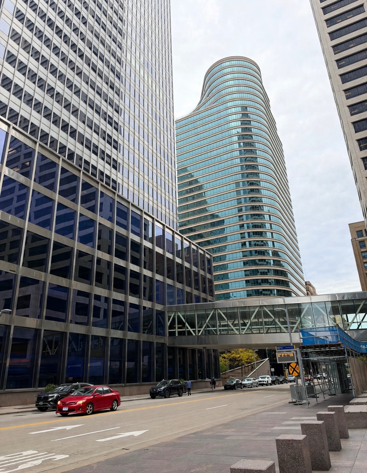 Winning Red Accent photograph — a downtown street in gray and blue, one red car at the corner