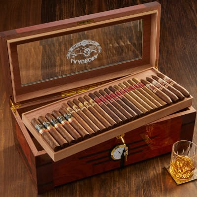 The La Aurora humidor shown opened with cigars inside.