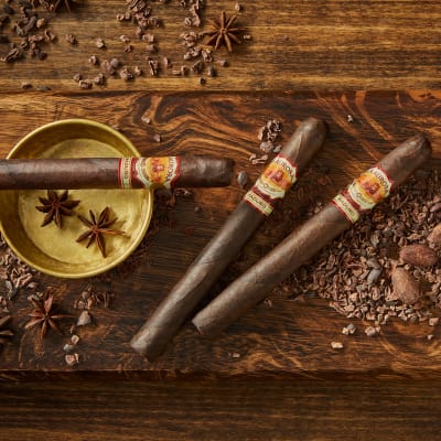 Three Maduro 1985 cigars surrounded by spices