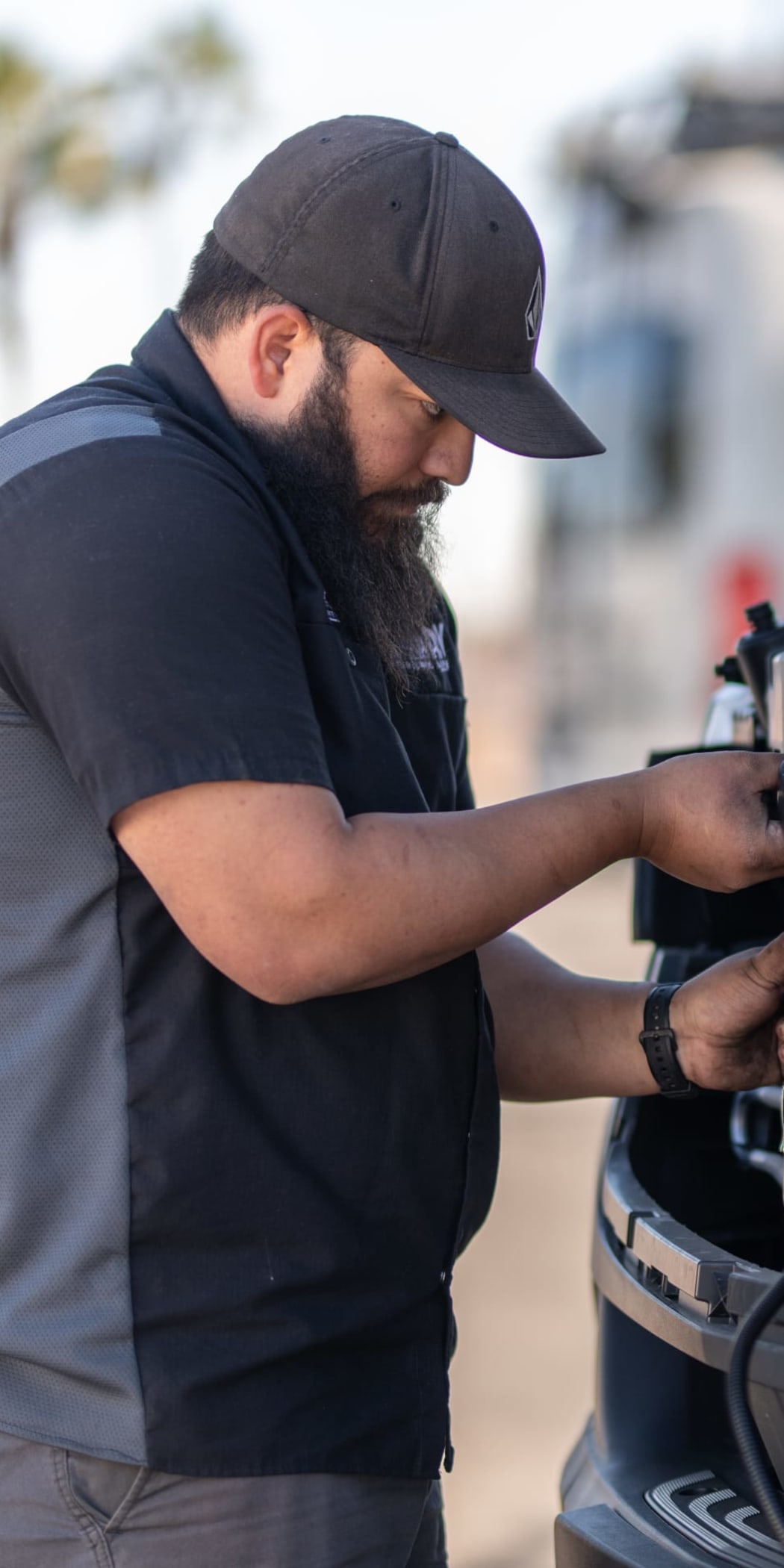 Upfitting technician installing a lighting kit