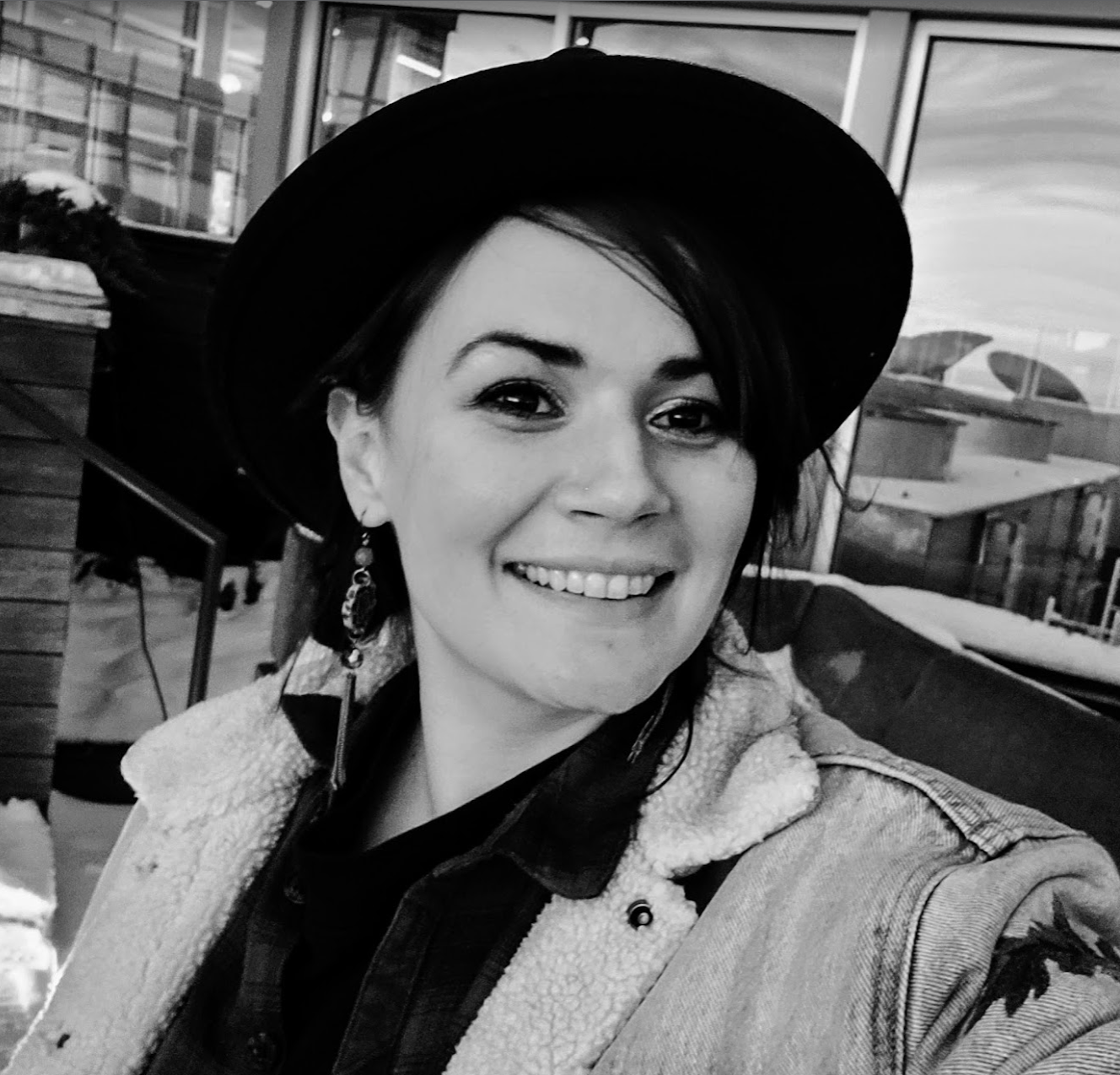 Joyanna in a hat and jean jacket