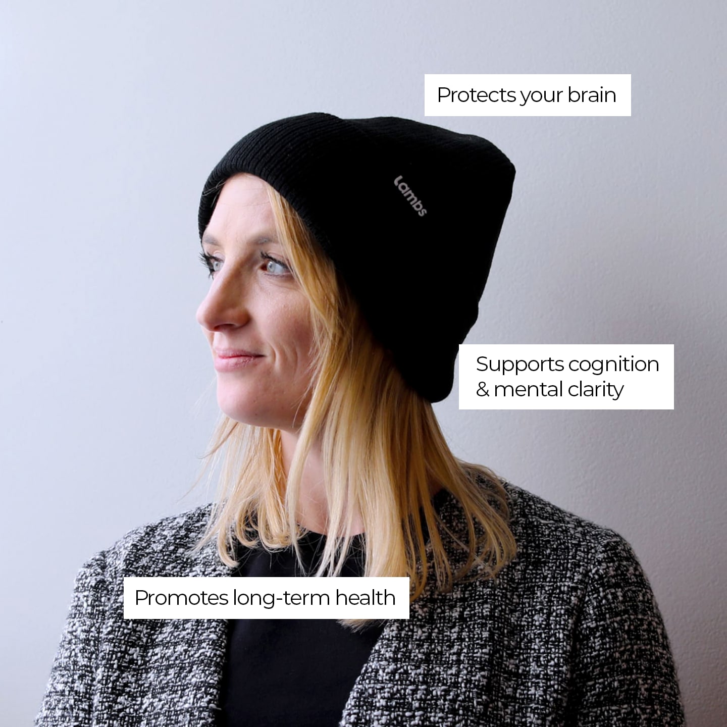 a woman wearing a black beanie with the words protect your brain on it