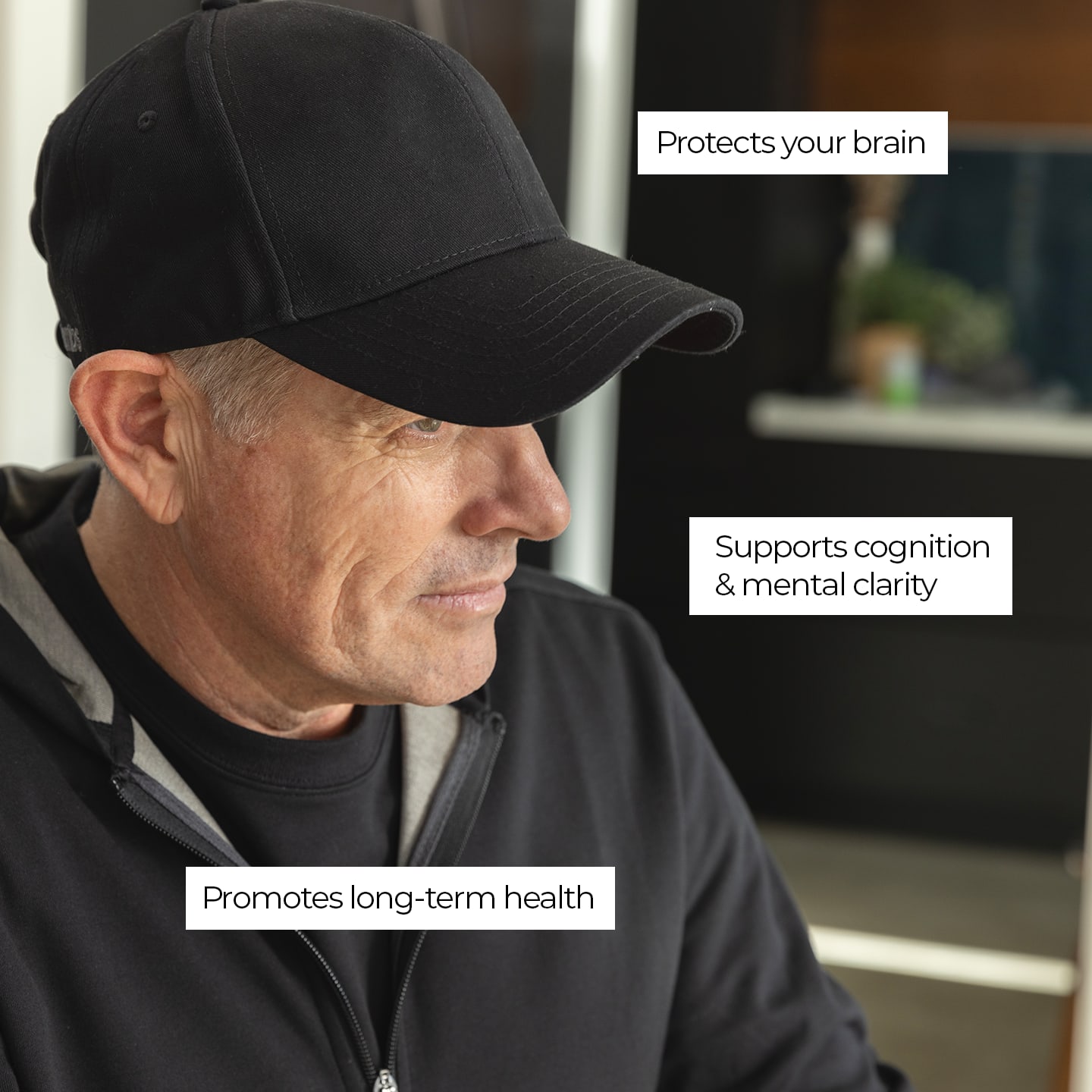 a man wearing a black hat with the words protect your brain