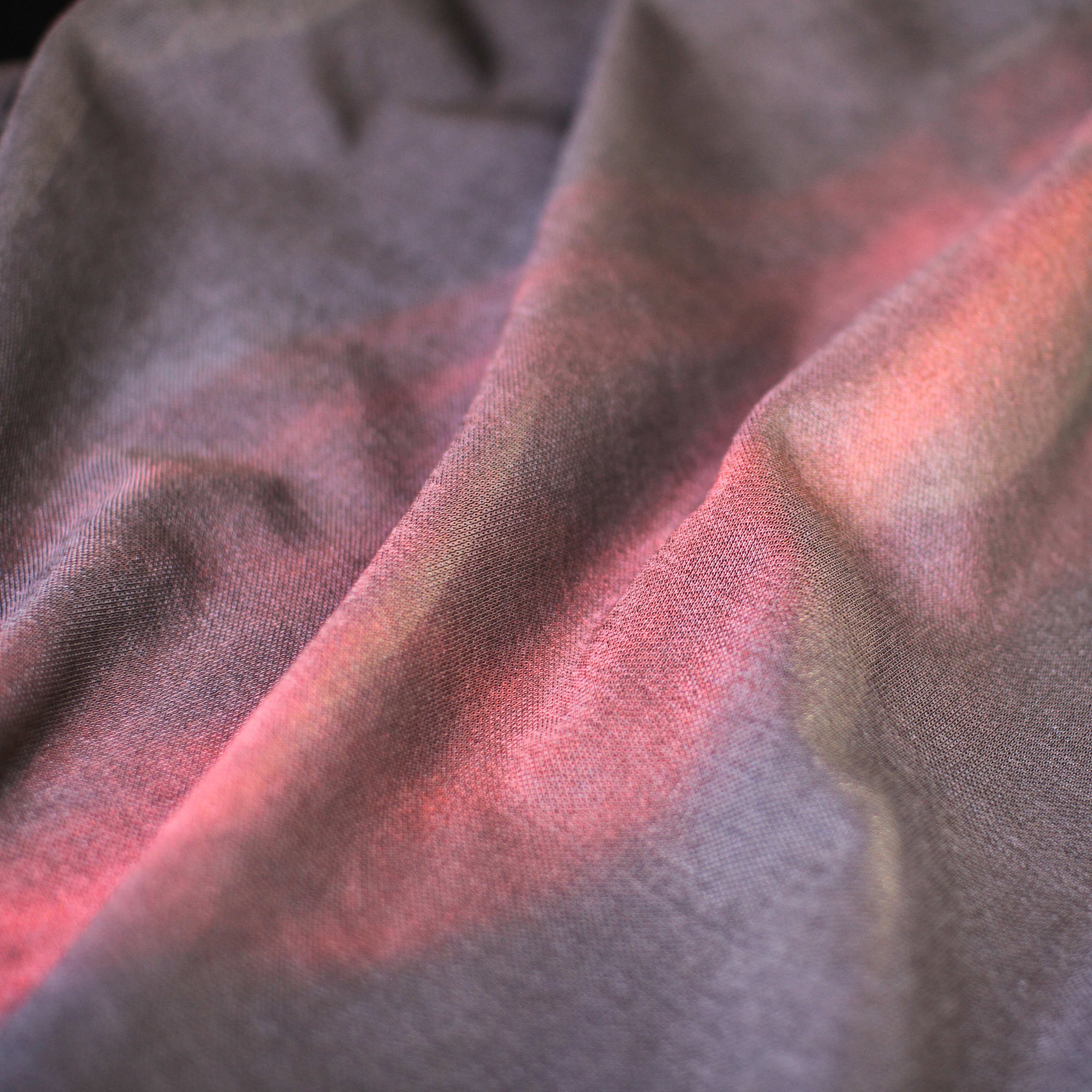 Close up of the fabric with a red light to illustrate the antibacterial property.