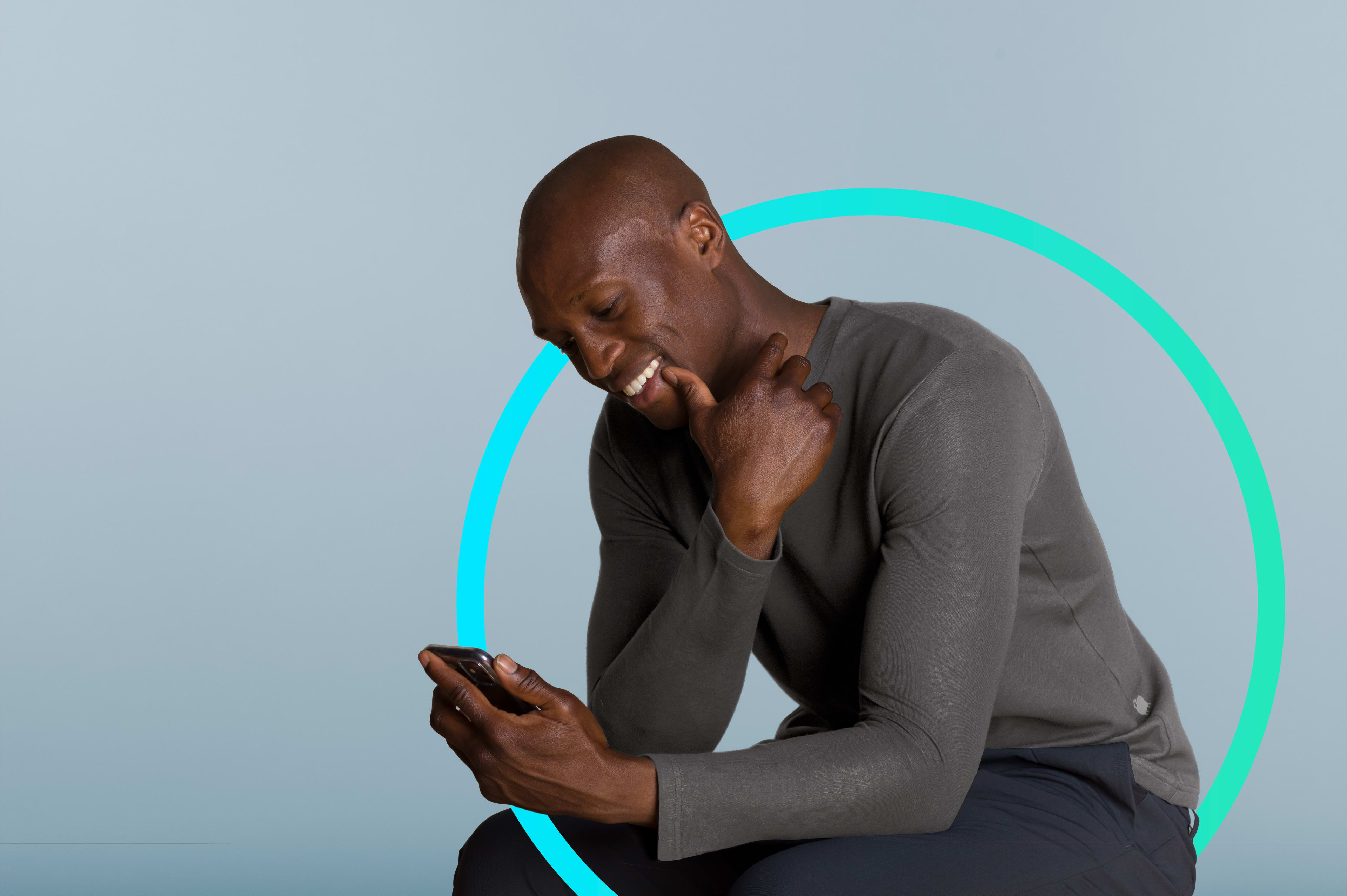 A person with a mobile phone in his hand. He is surrounded by a circle to illustrate protection