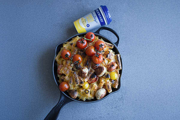 Cheesy chicken mac & cheese baked with meatballs, cherry tomatoes and Lancewood cheese sauce for a hearty meal.