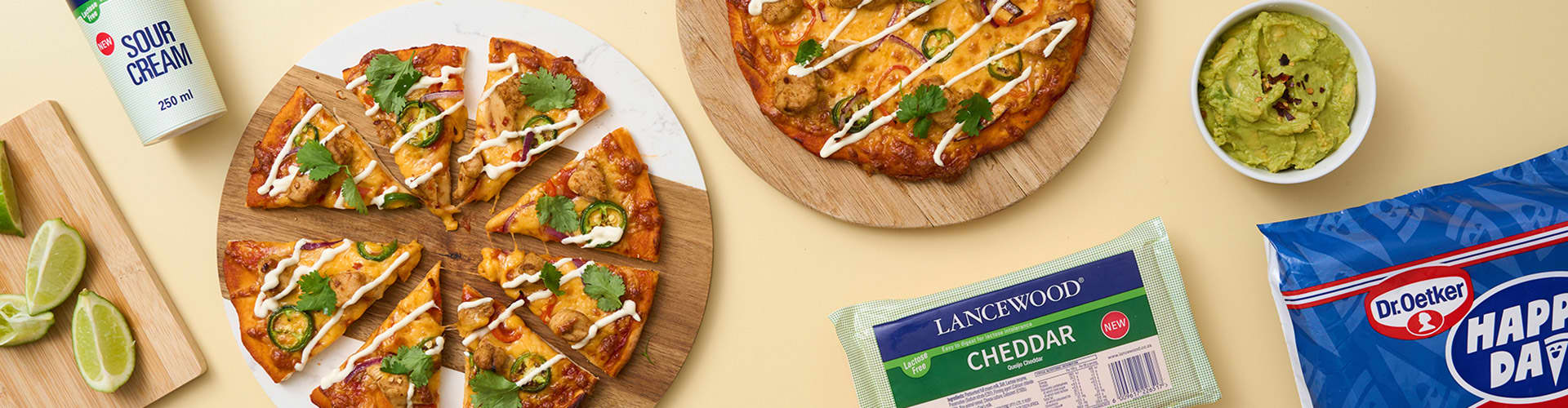 Homemade Mexican Chicken Pizza with spicy chicken, veggies and melted lactose-free cheese.