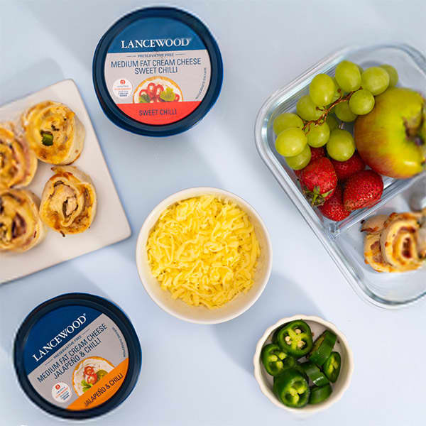 Easy lunch box ideas: Lancewood Cream Cheese pinwheels paired with fresh fruit and cheese.