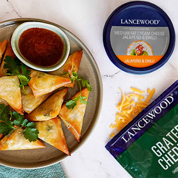 Phyllo pastry recipes made simple with Lancewood Cream Cheese and cheddar, served with spicy dip.