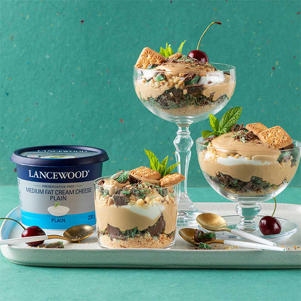 Easy peppermint crisp tart recipe with Lancewood Cream Cheese, layered biscuits, caramel and mint chocolate topping.