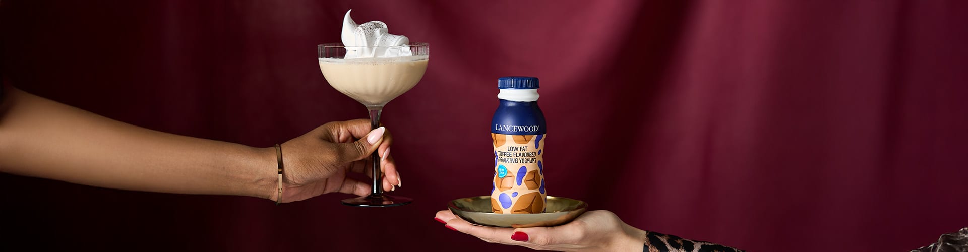 Toffee yoghurt and rum cocktail topped with cream – festive drink that doubles as an easy dessert recipe idea.