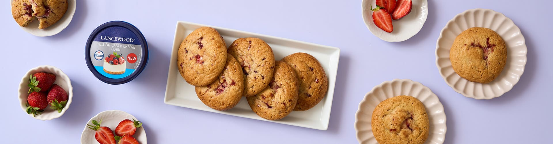 Easy cheesecake cookie recipe showing jam-swirled filled cookies