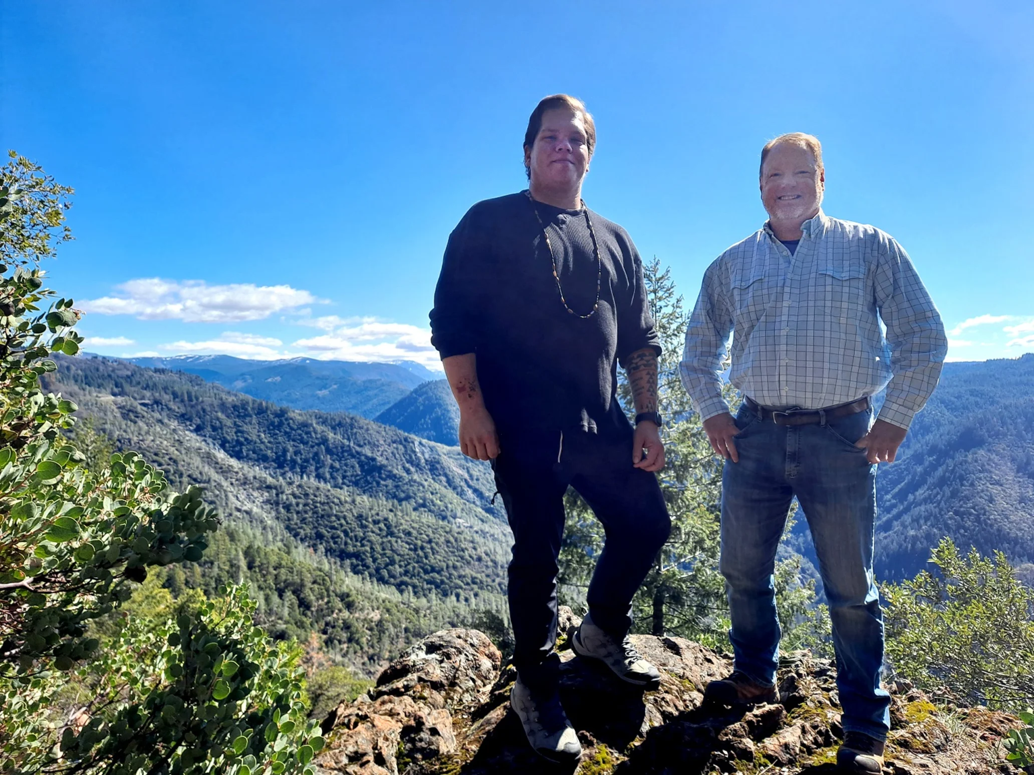 Tribal chairman of the Colfax-Todds Valley Consolidated Tribe and executive director of Placer Land Trust stand together at the land that has been returned to the tribe